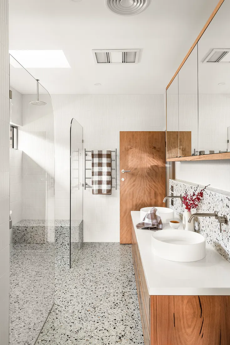Walk-in shower with brass fittings by MNA Builds