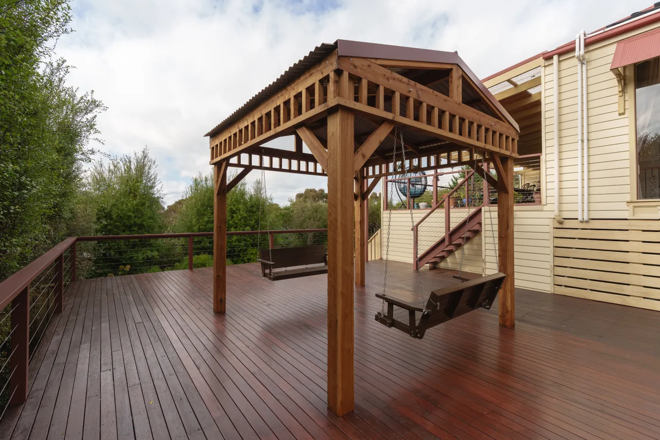 Large merbau deck with custom timber pergola built by MNA Builds